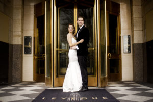 Bride and Groom Outside Hotel LeVeque Wedding Venue